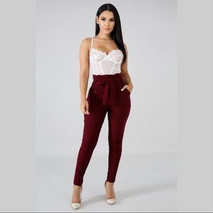 Burgundy, high waisted dress pants.